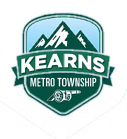 Shield logo displaying mountains and the name Kearns Metro Township